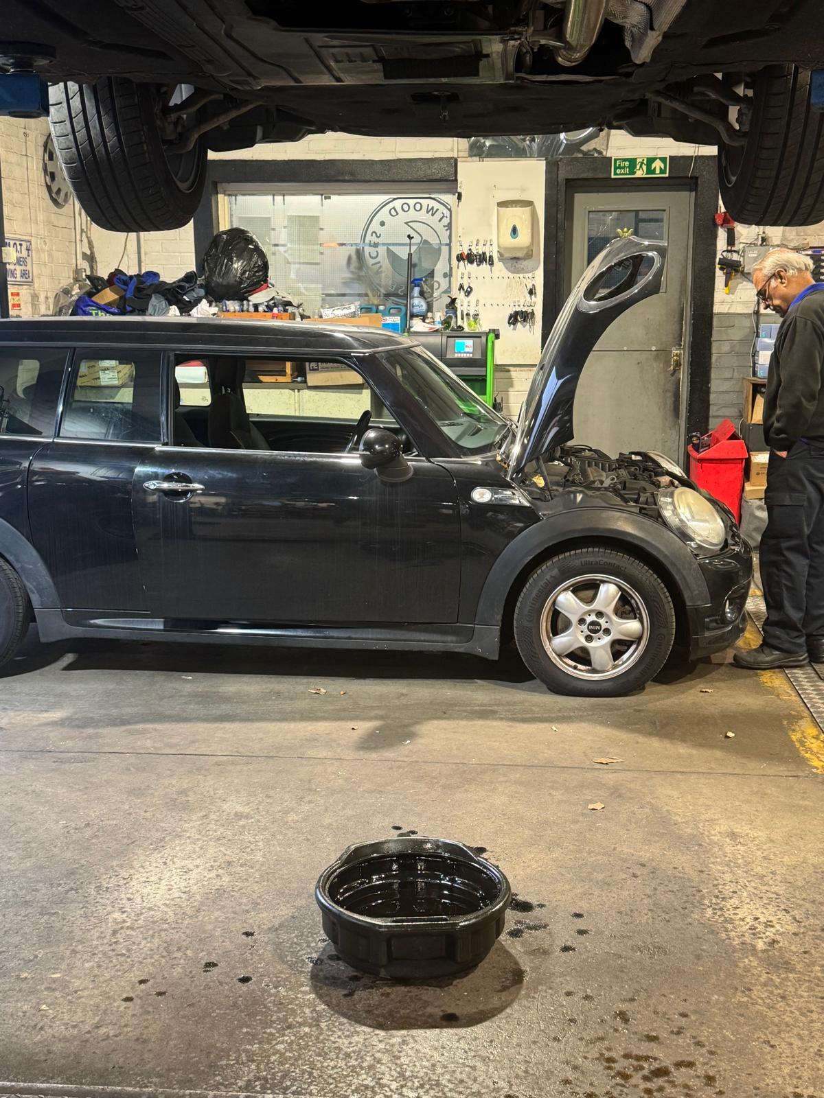 Mini Cooper having an oil and filter change during a car service at Courtwood Car Services Uxbridge