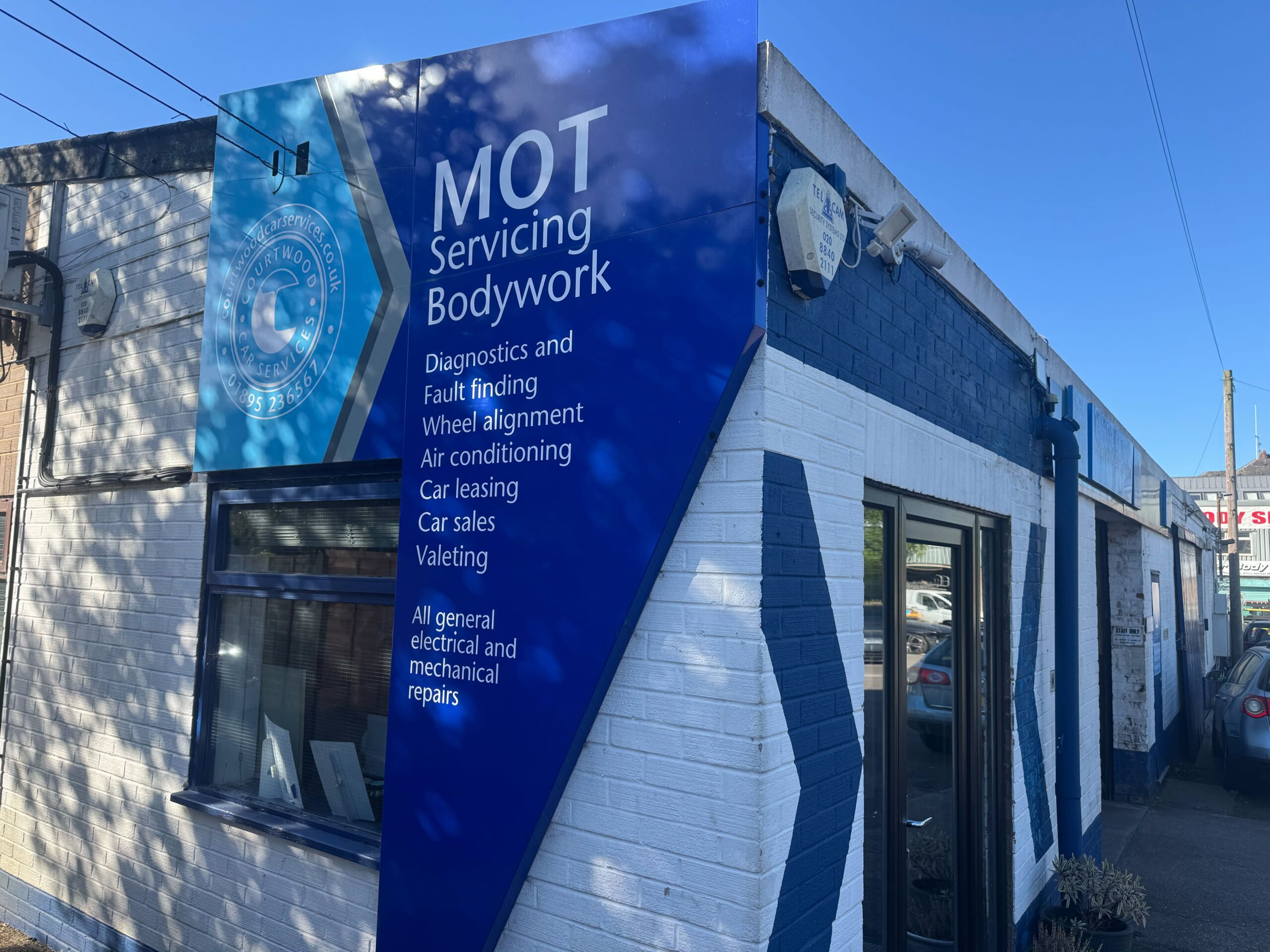 Courtwood Car Services MOT and servicing signage outside the Uxbridge garage
